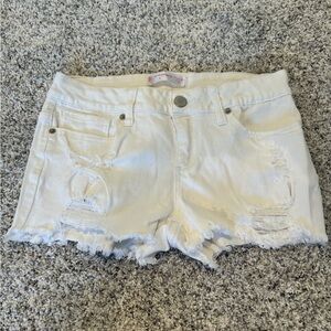 Ripped white jean shorts